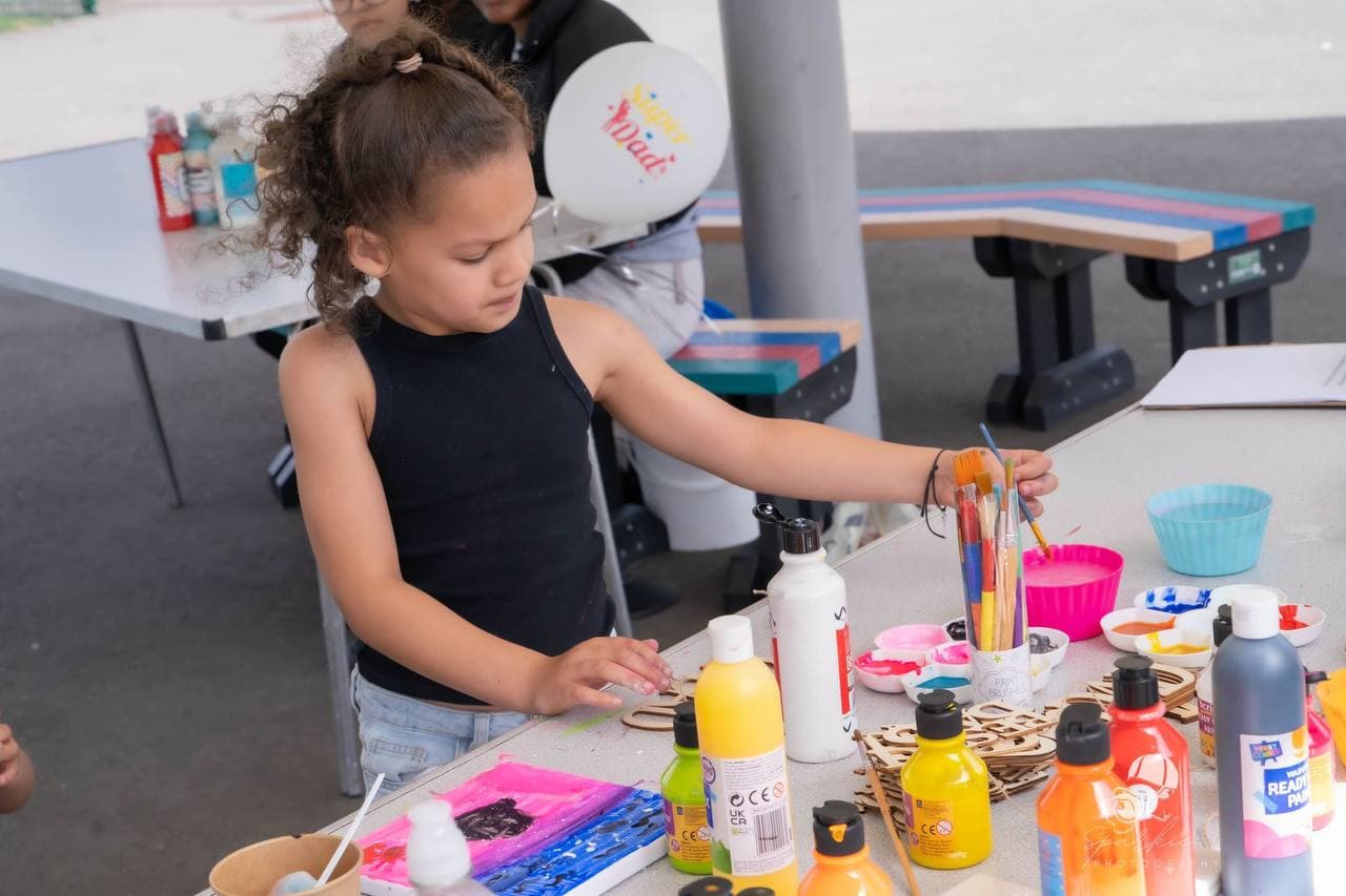 Child taking part in creative activities at Roots & Wings 2024