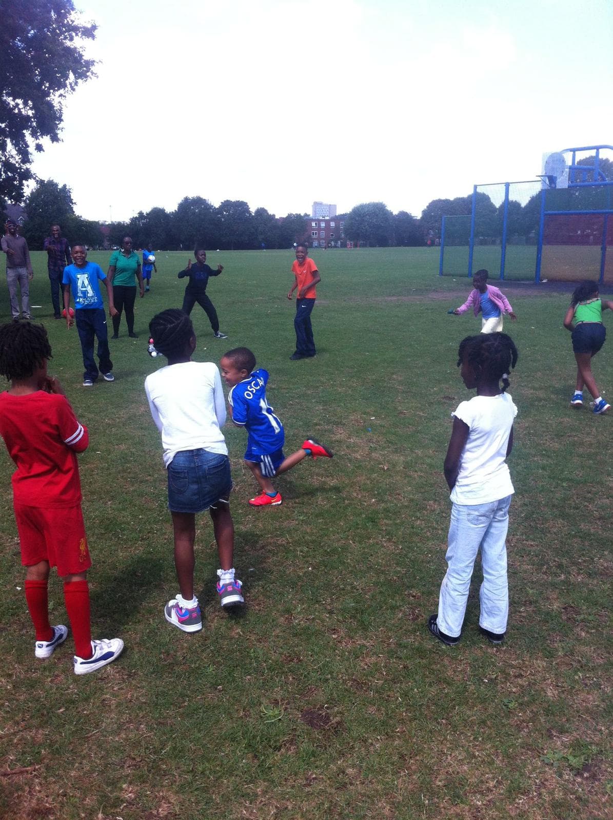 Hold It Down CIC members gathered around a table in matching blue hoodies