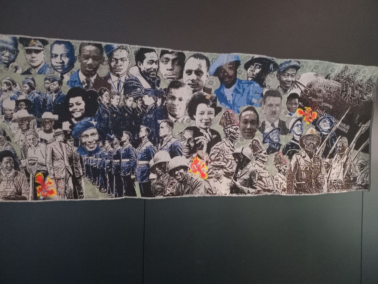 Textile display featuring historical figures viewed during a Stitch Craft N Knit group visit